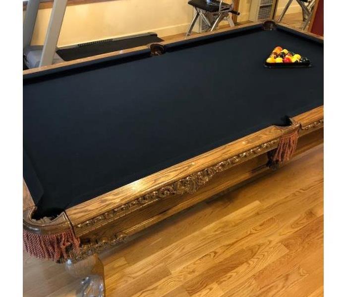 Cleaned black felt top pool table 