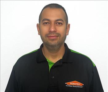 male Staff smiling in a servpro polo