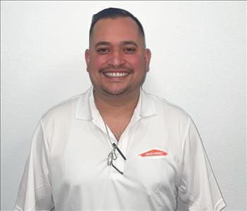 male in white servpro polo