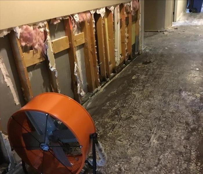 Range Fan drying out water soaked drywall