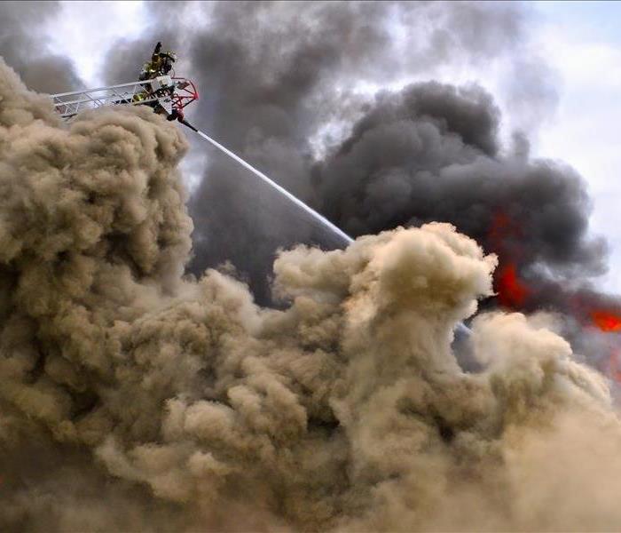 Fireman putting out a large fire