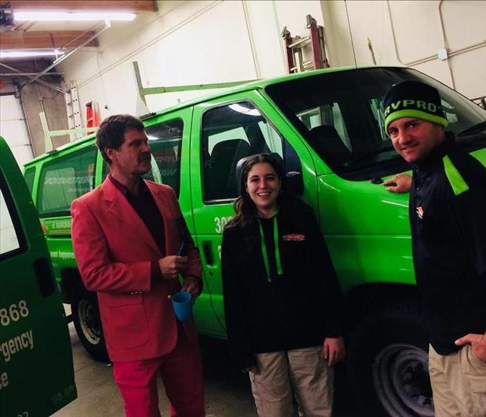 SERVPRO interviewing a man in a red suit