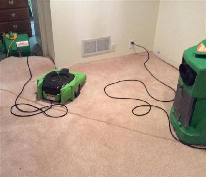 Dehumidifier and air mover on carpet
