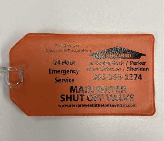 Orange servpro logo main water shutoff valve words
