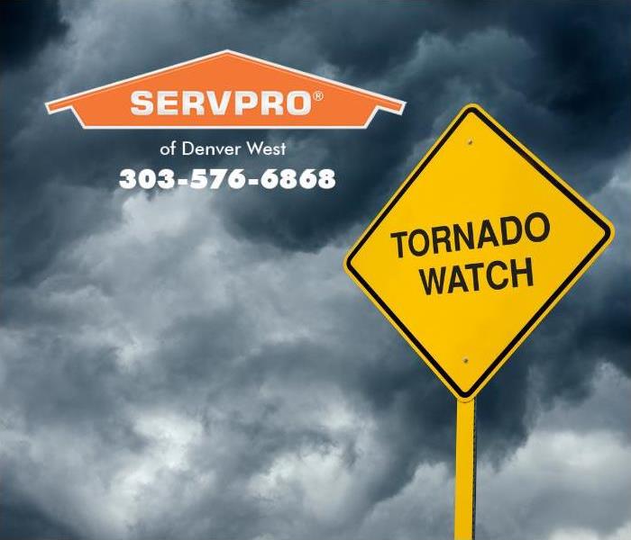 A turbulent sky and a yellow “Tornado Watch” sign are featured.
